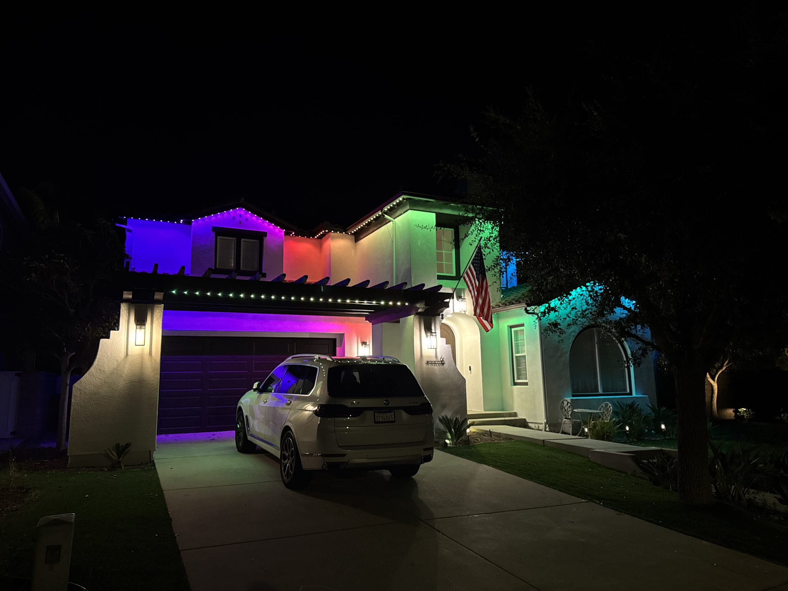 Beautiful permanent holiday lighting installed on a home. Energy-efficient LED lights for year-round sparkle.