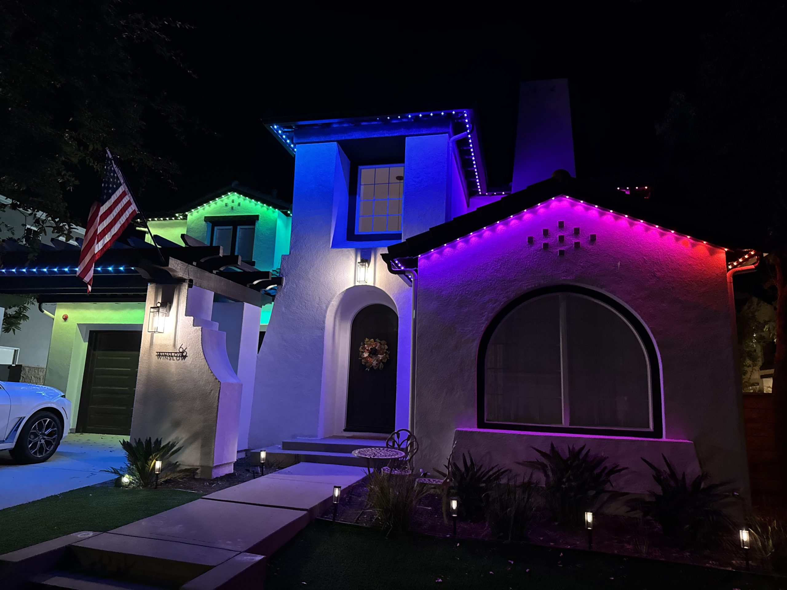 Beautiful permanent holiday lighting installed on a home. Energy-efficient LED lights for year-round sparkle.