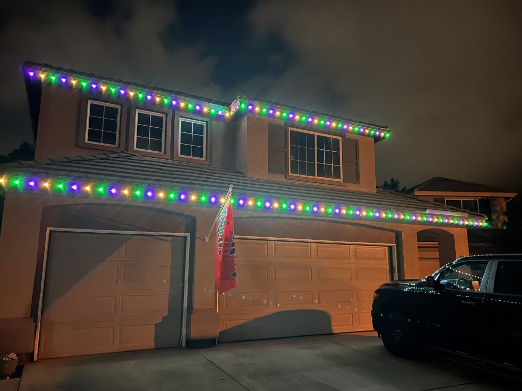 Beautiful permanent holiday lighting installed on a home. Energy-efficient LED lights for year-round sparkle.