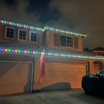 Beautiful permanent holiday lighting installed on a home. Energy-efficient LED lights for year-round sparkle.